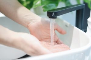 person washing hands