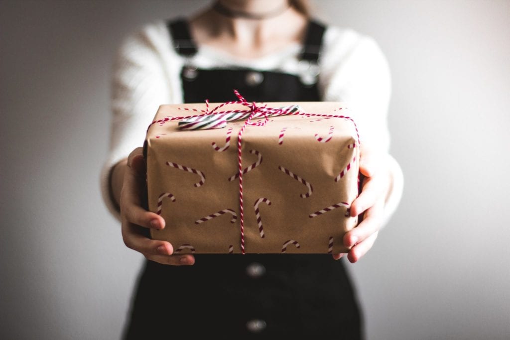 woman holding Christmas gift