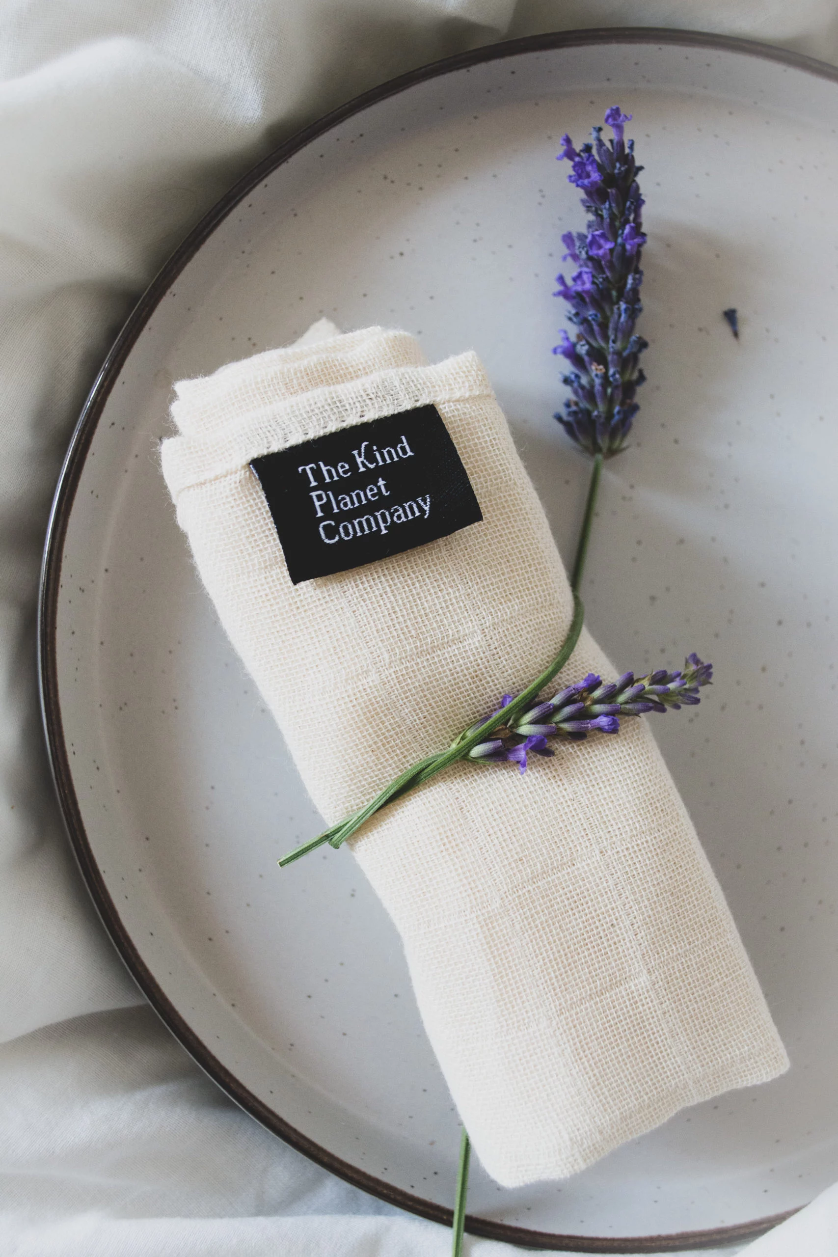 Organic Cotton Muslin Cloth wrapped in a lavender stem