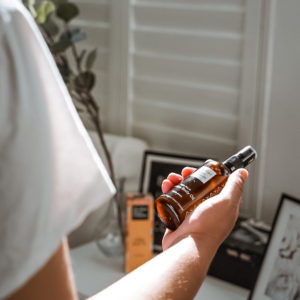 woman holding Golden Body Oil